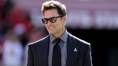 Tom Brady walks on the field during an NFL football game between the Los Angeles Rams and the San Francisco 49ers (AP) Tom Brady walks on the field during an NFL football game between the Los Angeles Rams and the San Francisco 49ers (AP)