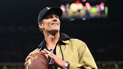 Former NFL player Tom Brady on the pitch before the match (REUTERS)