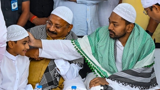 Patna: JDU leader Nishant Kumar, right, greets a child during celebrations on the occassion of Eid Al-Fitr, at Gandhi Maidan in Patna, Bihar, Saturday, March 21, 2026. (PTI Photo)(PTI03_21_2026_000027B) (PTI)