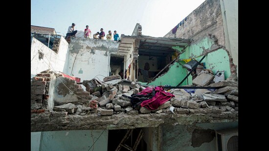 Victims include a couple hit by falling debris; police arrest owner, caretaker as probe flags poor building condition. (PTI)