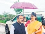 A photo showing Rupali Chakankar, chairperson of the state women’s commission, holding an umbrella for Ashok Kharat was shared widely on social media