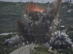 Smoke and flames rise from an Israeli airstrike that hit the Qasmiyeh Bridge near the coastal city of Tyre, Lebanon.