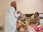 Grieving family members of Punjab State Warehousing Corporation (PSWC) district manager, Gagandeep Singh Randhawa in, Amritsar on Saturday. 