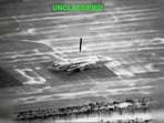 A projectile falls on an aircraft at an unknown location in the still image obtained from a video released by U.S. Central Command (CENTCOM)