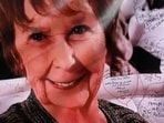 Notes are written on a photo of Nancy Guthrie that is displayed in front of the KVOA television station on March 01, 2026