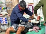 Tinsukia: An injured person receives medical treatment at Assam Medical College and Hospital following an alleged attack at a police commando camp, in Tinsukia district of Assam, Sunday, March 22, 2026. (PTI Photo)(PTI03_22_2026_000036A)