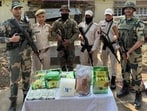Security forces with the seized contraband in Manipur. (HT Photo) Security forces with the seized contraband in Manipur. (HT Photo)