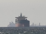 Cargo ships in the Gulf, near the Strait of Hormuz, as seen from northern Ras al-Khaimah, near the border with Oman’s Musandam governance