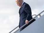 Trump sparks fresh health fears as he appears to struggle down Air Force One stairs (Photo by SAUL LOEB / AFP)