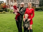 Billionaire John Caudwell with his partner, former Olympian Modesta Vzesniauskaite, and two of his children.
