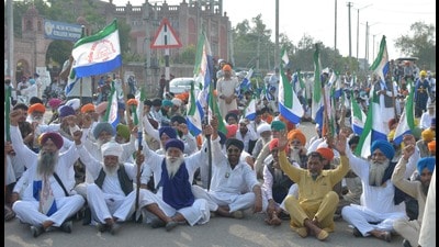Farmers blocking the the Ram Tirath road during a protest against the central and state governments in Amritsar on Sunday.