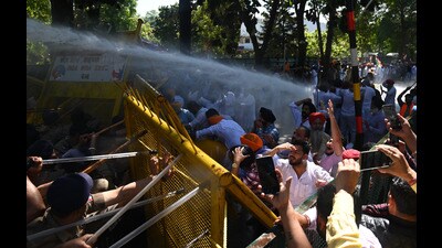 Punjab BJP, Congress, SAD, and CPI workers tried to force their way through barricades here to 'gherao' the residence of Punjab Chief Minister Bhagwant Mann during a joint protest to demand the arrest of former minister Laljit Singh Bhullar, who is accused of abetting the suicide of a state warehousing corporation official at MLA hostel in Chandigarh on Sunday, March 22, 2026.Photo by Keshav Singh/ Hindustan Times (Keshav Singh/ HT) Punjab BJP, Congress, SAD, and CPI workers tried to force their way through barricades here to 'gherao' the residence of Punjab Chief Minister Bhagwant Mann during a joint protest to demand the arrest of former minister Laljit Singh Bhullar, who is accused of abetting the suicide of a state warehousing corporation official at MLA hostel in Chandigarh on Sunday, March 22, 2026.Photo by Keshav Singh/ Hindustan Times (Keshav Singh/ HT)