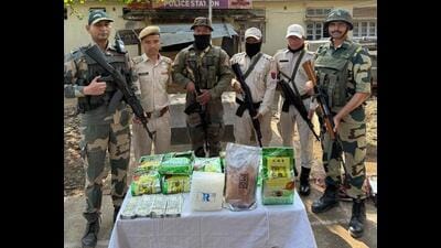 Security forces with the seized contraband in Manipur. (HT Photo) Security forces with the seized contraband in Manipur. (HT Photo)