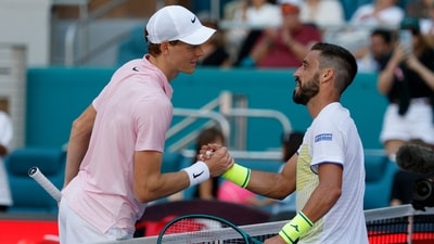 Jannik Sinner (ITA) (L) shakes hands with Damir Dzumhur (BIH) (R) at the net after their match on day five of the 2026 Miami Open at Hard Rock Stadium (IMAGN IMAGES via Reuters Connect)