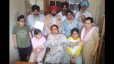 Upinder Kaur, wife of late Punjab State Warehousing Corporation (PSWC) district manager Gagandeep Singh Randhawa, addresses a press conference along with her children and family members at their residence.in, Amritsar, on Sunday, March 22,2026. (Sameer Sehgal/HT) Upinder Kaur, wife of late Punjab State Warehousing Corporation (PSWC) district manager Gagandeep Singh Randhawa, addresses a press conference along with her children and family members at their residence.in, Amritsar, on Sunday, March 22,2026. (Sameer Sehgal/HT)