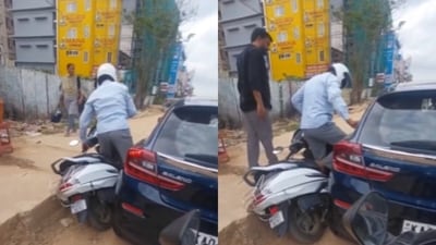 In Bengaluru, a scooter hit a car, but the driver responded calmly and offered help, winning appreciation online. (X/@karnatakaportf) In Bengaluru, a scooter hit a car, but the driver responded calmly and offered help, winning appreciation online. (X/@karnatakaportf)