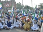 Farmers blocking the the Ram Tirath road during a protest against the central and state governments in Amritsar on Sunday.