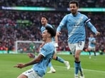 Manchester City's Nico O'Reilly celebrates after scoring in the League Cup final against Arsenal. (AP)