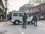 Security outside the residence of Henlianthang Thanglet, the chairman of the Kuki-Zo Council (KZC), in Churachandpur on Monday. (ANI)