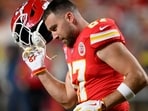Kansas City Chiefs tight end Travis Kelce takes off his helmet during warmups before an NFL football game against the Denver Broncos Kansas City Chiefs tight end Travis Kelce takes off his helmet during warmups before an NFL football game against the Denver Broncos