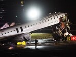 An Air Canada Express plane sits on the tarmac after it collided with a fire truck on the tarmac at LaGuardia Airport on March 23, 2026 in New York City. 