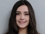 Kentucky woman accused of driving Tesla into crowd, leaving four injured.