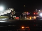 An Air Canada Express plane sits on the tarmac after it collided with a fire truck on the tarmac at LaGuardia Airport 