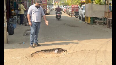 The two sinkholes near Mint Ghumari Chowk in Model Mown in Ludhiana on Monday. (HT Photo)