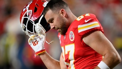 Kansas City Chiefs tight end Travis Kelce takes off his helmet during warmups before an NFL football game against the Denver Broncos (AP) Kansas City Chiefs tight end Travis Kelce takes off his helmet during warmups before an NFL football game against the Denver Broncos (AP)