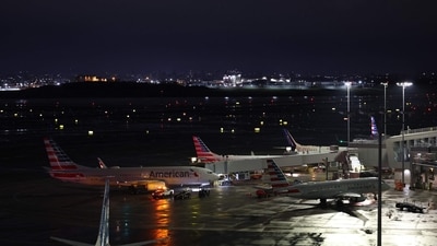 Planes sit at gates after a ground stoppage was issued following a collision between an Air Canada Express CRJ-900 and a Port Authority fire truck at LaGuardia Airport in New York. (AFP) Planes sit at gates after a ground stoppage was issued following a collision between an Air Canada Express CRJ-900 and a Port Authority fire truck at LaGuardia Airport in New York. (AFP)