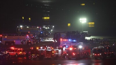 Emergency personnel respond to an Air Canada Express CRJ-900 after colliding with a Port Authority fire truck at LaGuardia Airport in New York. (AFP) Emergency personnel respond to an Air Canada Express CRJ-900 after colliding with a Port Authority fire truck at LaGuardia Airport in New York. (AFP)