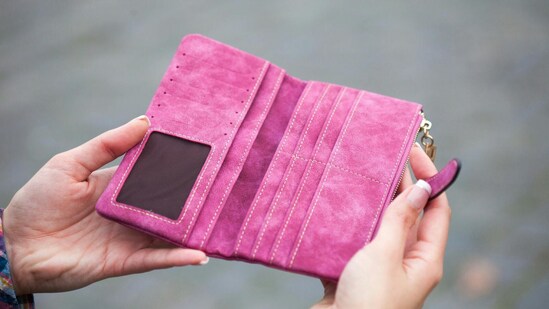 Chic two-fold wallets in fresh colours and textures sit ready to organise cards, cash, and tiny essentials inside your handbag. (pexels.com)