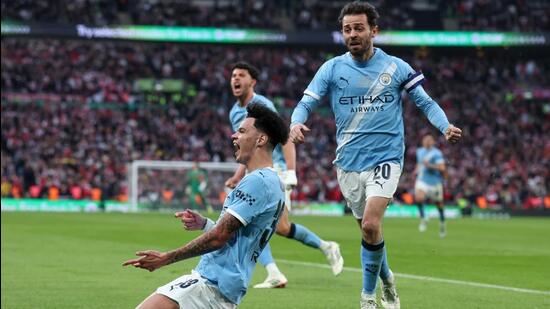 Manchester City's Nico O'Reilly celebrates after scoring in the League Cup final against Arsenal. (AP)