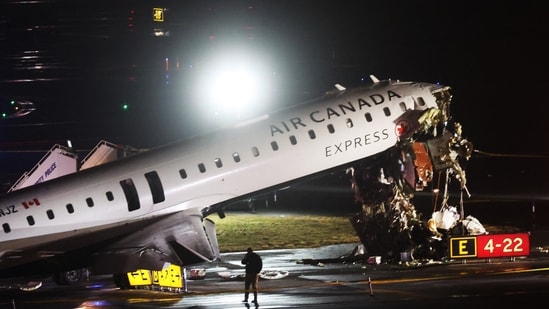 An Air Canada Express plane sits on the tarmac after it collided with a fire truck on the tarmac at LaGuardia Airport on March 23, 2026 in New York City. (Getty Images via AFP)