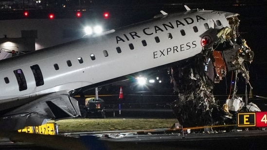 Debris hangs from a damaged Air Canada Express jet that had collided with a ground vehicle at New York's LaGuardia Airport in Queens, New York, U.S., March 23, 2026. REUTERS/Bing Guan(REUTERS)