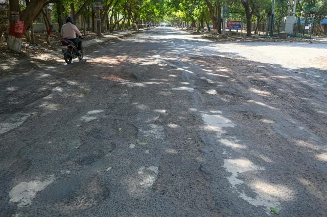 Stretch to metro station damaged despite recent repairs. Locals cite delays, failed patchwork; officials say work to begin soon. (Parveen Kumar/HT) Stretch to metro station damaged despite recent repairs. Locals cite delays, failed patchwork; officials say work to begin soon. (Parveen Kumar/HT)