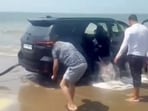 Water was seen gushing out of the Fortuner after it became stuck on a Goa beach Water was seen gushing out of the Fortuner after it became stuck on a Goa beach