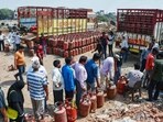 People stand in a long queue with their LPG cylinders outside a gas agency amid the reported LPG supply shortage, in Prayagraj earlier this month. People stand in a long queue with their LPG cylinders outside a gas agency amid the reported LPG supply shortage, in Prayagraj earlier this month.