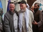 American Dennis Coyle, second from right, is accompanied by an unidentified person after being released by Afghanistan's Taliban authorities, who had held him for over a year, before boarding a plane at the airport in Kabul, Afghanistan, Tuesday, March 24, 2026. (AP Photo/Mudassir Safi) American Dennis Coyle, second from right, is accompanied by an unidentified person after being released by Afghanistan's Taliban authorities, who had held him for over a year, before boarding a plane at the airport in Kabul, Afghanistan, Tuesday, March 24, 2026. (AP Photo/Mudassir Safi)
