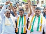 Chief minister Siddaramaiah and deputy CM DK Shivakumar with Samarth Shamanur in Davanagere on Monday. (ANI)