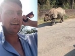 A UK man was stunned as a massive rhino calmly walked past him on a street in Nepal.