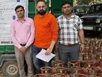 District Food and Supplies Controller (DFSC) officials with the seized cylinders. (HT)