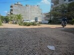 A cratered stretch in an internal road in Sector 57, near Sushant Lok Phase 2. (Parveen Kumar/HT)