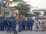 (File photo) Security personnel stand guard during the "Virat Aakrosh Sabha" called by the United Hindu Front over the death of Tarun, due to an alleged fight during Holi at Uttam Nagar in Delhi earlier this month. 