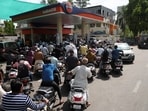 People queue  in Ahmedabad to fill petrol in their two-wheelers with concerns over potential supply disruptions, but authorities say there are no shortages, amid the ongoing U.S.-Israeli conflict with Iran. 