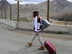 An Iranian refugee walks with his belongings after crossing the border from Iran to Armenia at a border check point in the southern Armenian town of Meghri, on March 9, 2026 (AFP FILE) An Iranian refugee walks with his belongings after crossing the border from Iran to Armenia at a border check point in the southern Armenian town of Meghri, on March 9, 2026 (AFP FILE)