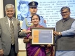 Family members of awardees with UT administrator Gulab Chand Kataria at Sector 10 on Tuesday. (HT file)