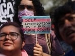 LGBTQIA+ community members hold placards during a protest demanding the withdrawal of the Transgender Amendment Bill 2026, in Mumbai, India, March 25, 2026. 