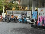 People queue to refuel at a petrol station in Hyderabad on March 25, 2026. Oil prices tumbled and stocks rose on March 25 on hopes for a de-escalation of the Middle East war after Washington sent a peace plan to Iran, while Tehran announced it will let "non-hostile" oil vessels through the crucial Strait of Hormuz. (Photo by NOAH SEELAM / AFP) People queue to refuel at a petrol station in Hyderabad on March 25, 2026. Oil prices tumbled and stocks rose on March 25 on hopes for a de-escalation of the Middle East war after Washington sent a peace plan to Iran, while Tehran announced it will let "non-hostile" oil vessels through the crucial Strait of Hormuz. (Photo by NOAH SEELAM / AFP)