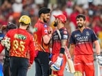 Jitesh Sharma and Virat Kohli shake hands with Punjab Kings players during IPL 2025. Jitesh Sharma and Virat Kohli shake hands with Punjab Kings players during IPL 2025.